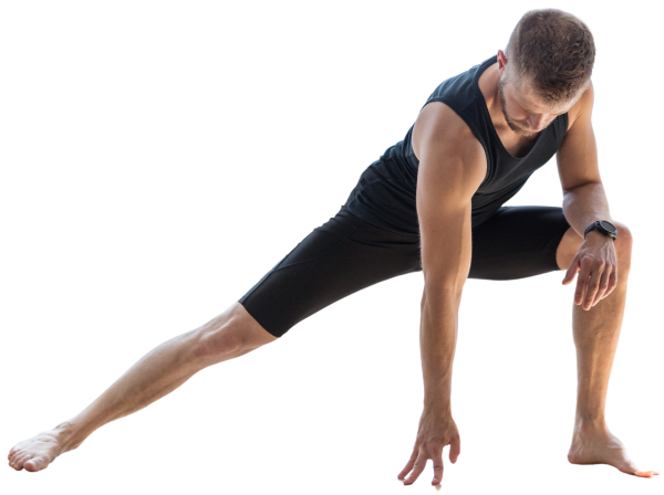 Male yogi focused side lunge